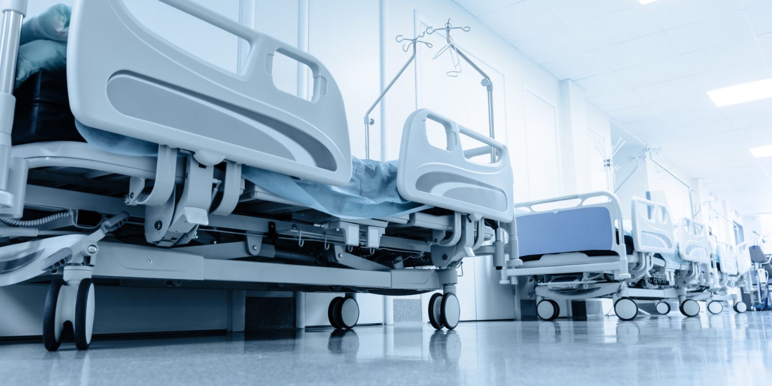 long corridor in hospital with surgical beds. tinted picture
